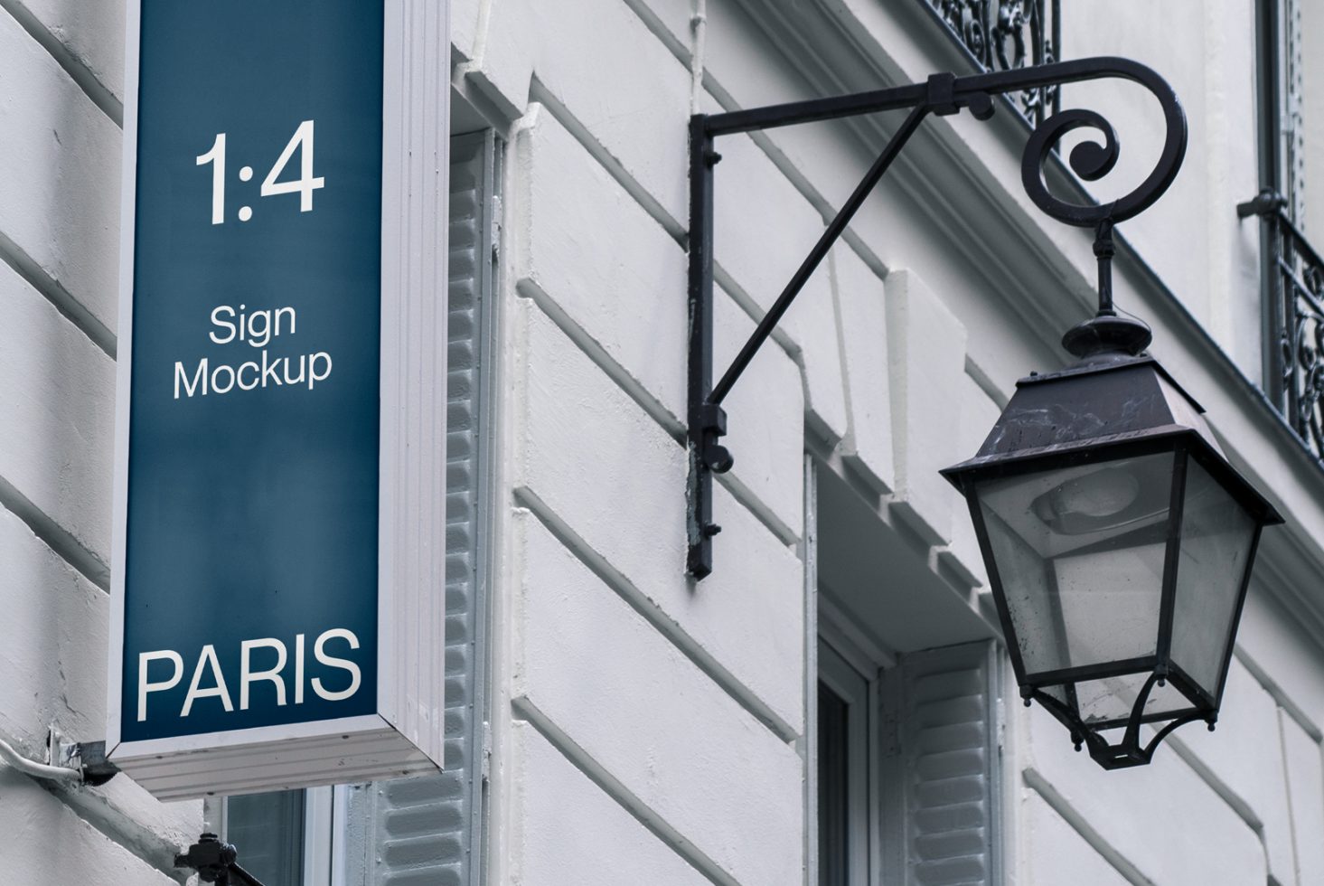 Vertical outdoor sign mockup on a classic Parisian building exterior with iron lamp, perfect for branding design presentation.